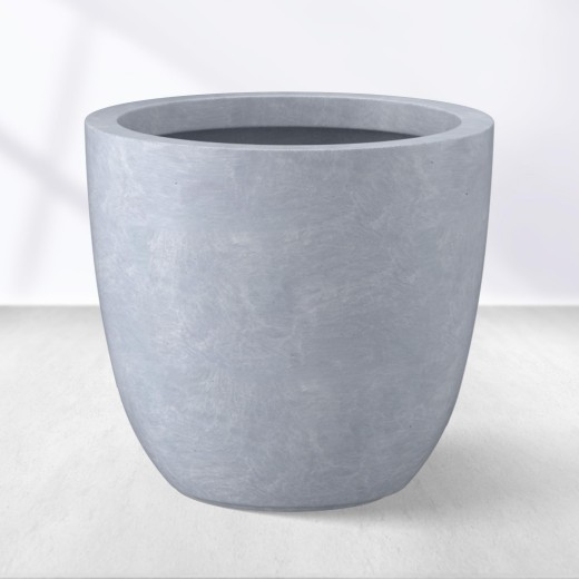 Single RC-1001 light gray round GFRC planter showing its tapered wall and rounded base